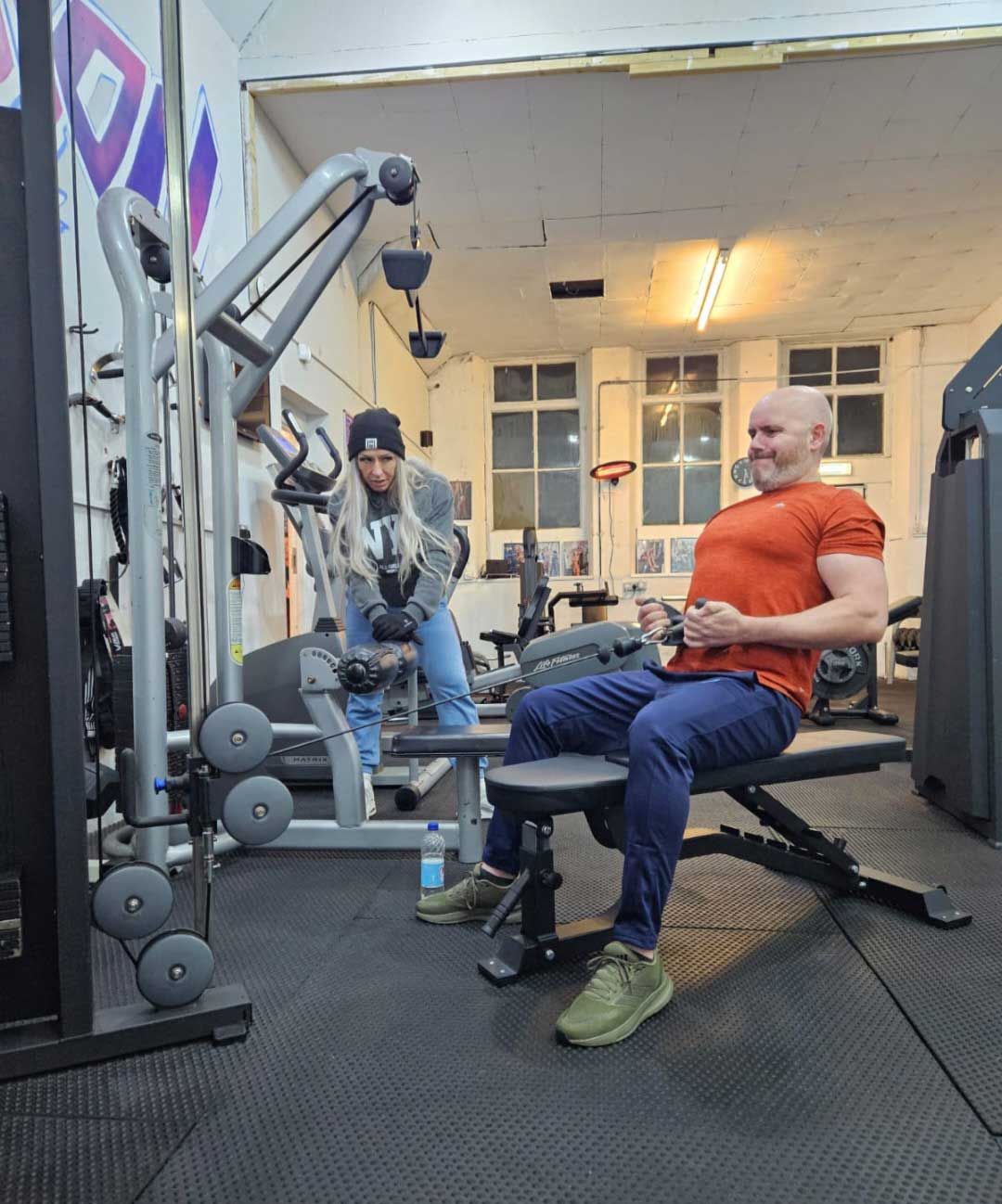 Julia coaching a client at B Strong